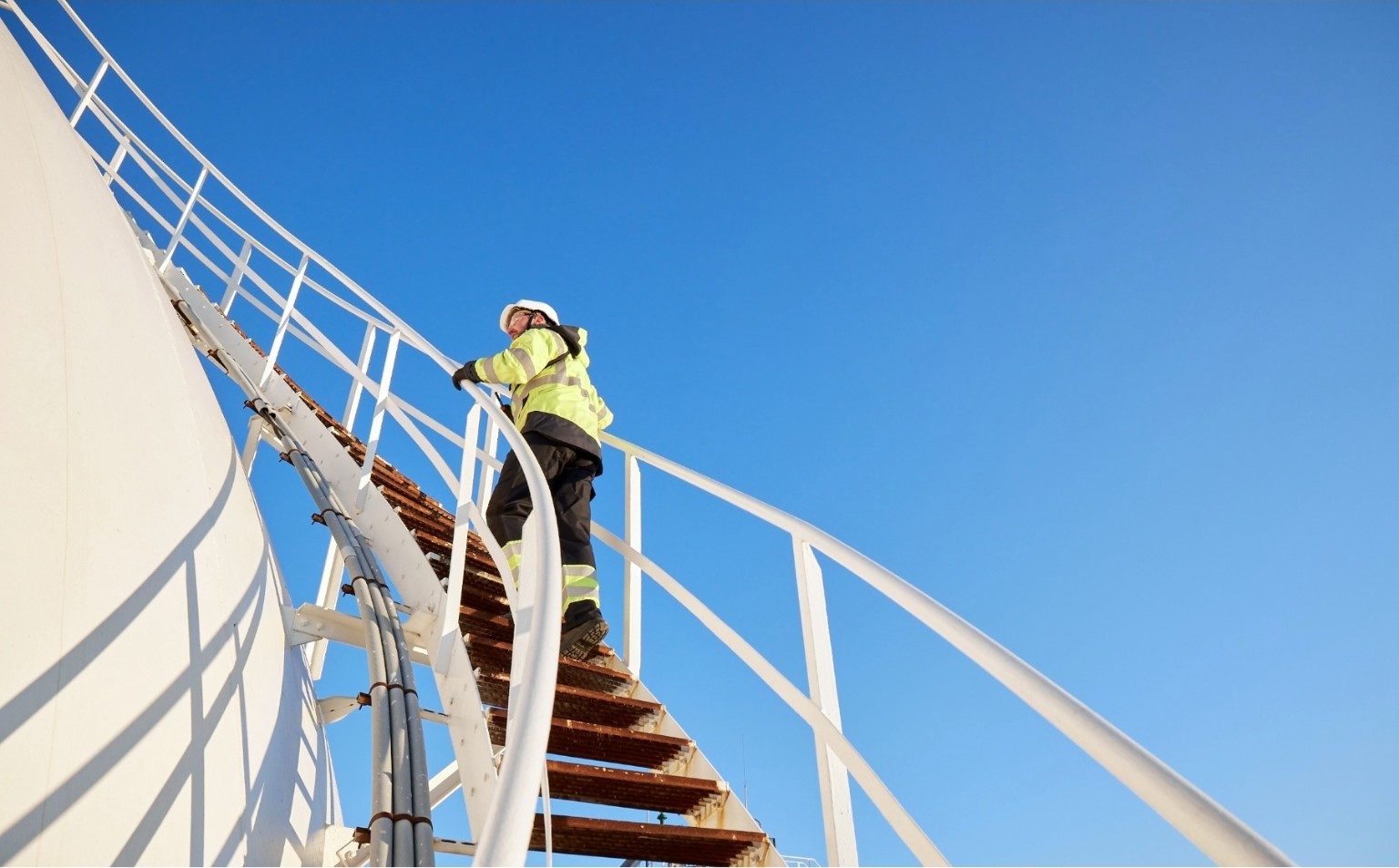 Engineer inspecting storage terminal infrastructure